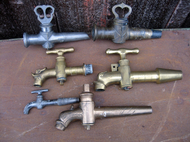 large photo of vintage wine spigots and taps