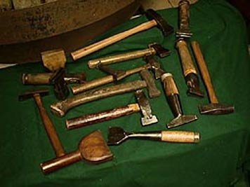 large photo of vintage hammers and drivers