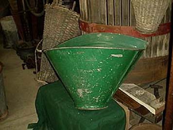large photo of vintage metal grape harvest basket in green paint